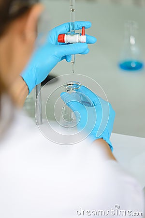 The woman whoâ€™s the scientist is demonstrate the titration technique Stock Photo